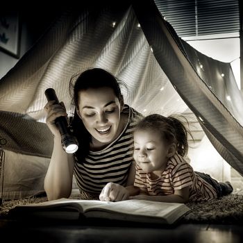 mother reading a book to her child